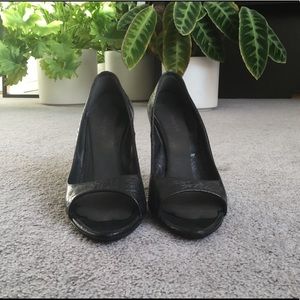 Roberto Cavalli black open toe pumps.